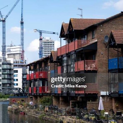 New high rise apartment block towers under construction over older waterfront low rise homes at the heart of Canary Wharf financial district on 7th May 2024 in London, United Kingdom. Canary Wharf is an area located near the Isle of Dogs in the London Borough of Tower Hamlets and is defined by the Greater London Authority as being part of Londons central business district. Along with the City of London, it constitutes one of the main financial centres in the United Kingdom and the world, containing many high-rise buildings including the third-tallest in the UK, One Canada Square. (photo by Mike Kemp/In Pictures via Getty Images)