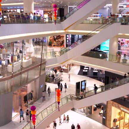 Many people walking and shopping in shopping mall